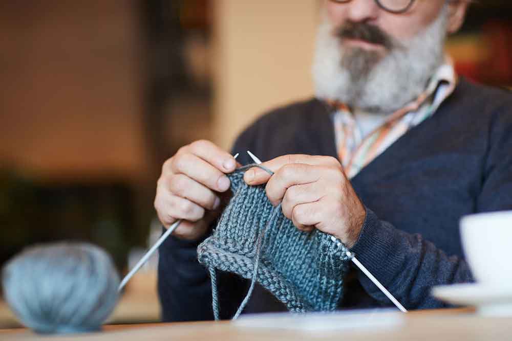 Man Knitting